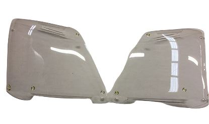 Pair of clear headlight covers on a white background